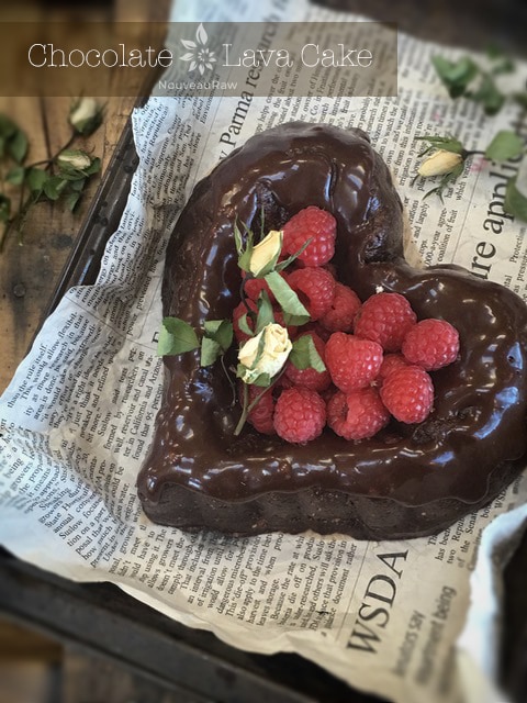 Chocolate-Lava-Cake covered in chocolate ganache and fresh raspberries
