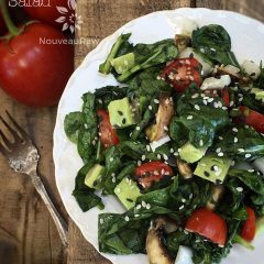 raw vegan Marinaded Wilted Spinach Mushroom Salad served on a white plate