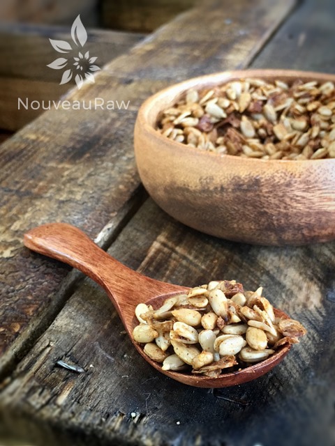 a close up of a healthy snack of Chipotle Spiced Sunflower Seeds served in a wooden bowl