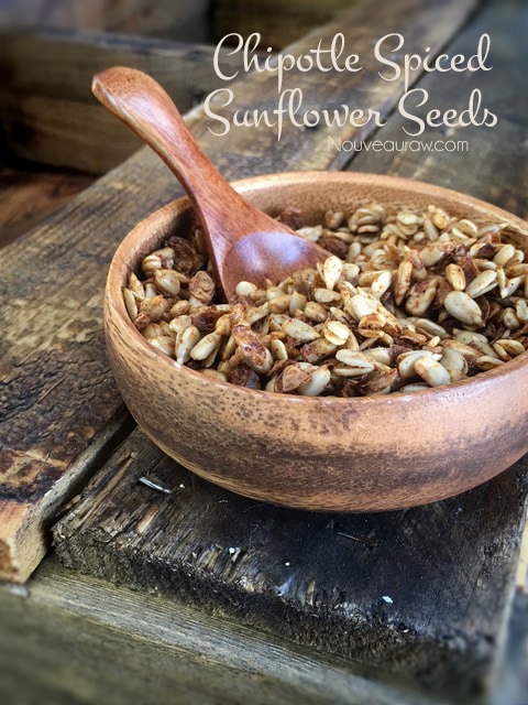 a healthy snack of Chipotle Spiced Sunflower Seeds served in a wooden bowl