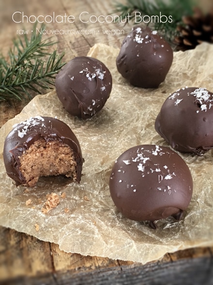 raw vegan gluten free delicious Chocolate Coconut Bombs displayed on parchment paper