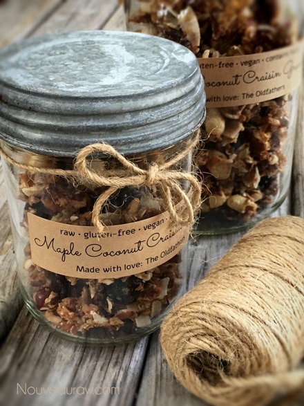 raw gluten-free Maple Coconut Craisin Granola displayed in mason jar and tied with twine