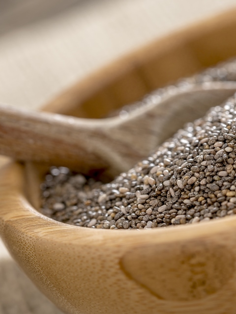 chia seeds close up in wooden bowl