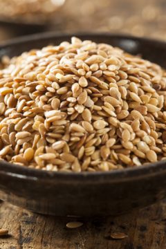 flax seeds in a wooden bowl
