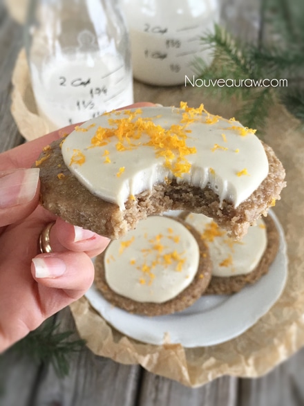 took a bite out raw vegan Frosted Orangesicle Sugar Cookies served with almond milk