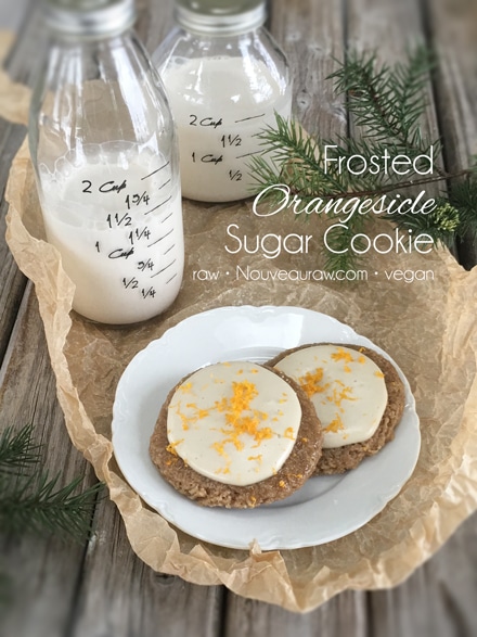 raw vegan Frosted Orangesicle Sugar Cookies served with almond milk
