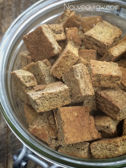 a close up of gluten free Italian Seasoned Croutons - using almond pulp stored in an airtight jar