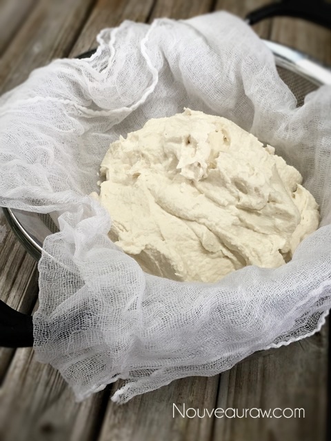 placing the Almond Cheese in cheesecloth to start fermenting