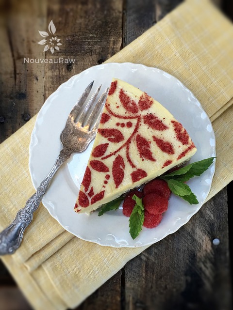 a single slice of my raw vegan Raspberry Lemon Cheesecake served on a white plate