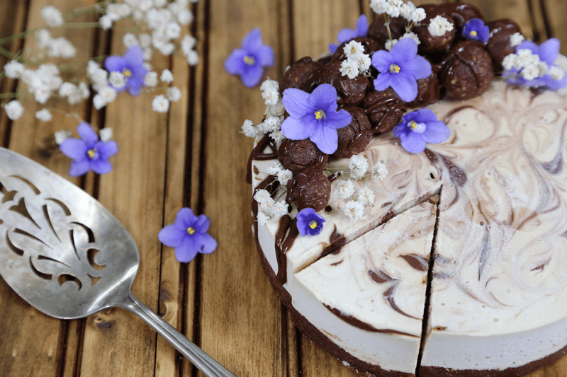 White Chocolate Caramel Cheesecake-decorated-with-violet-flowers