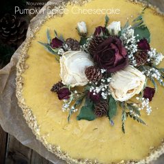 over view of removing a slice of Pumpkin Spice Cheesecake with Pecan Caramel Sauce