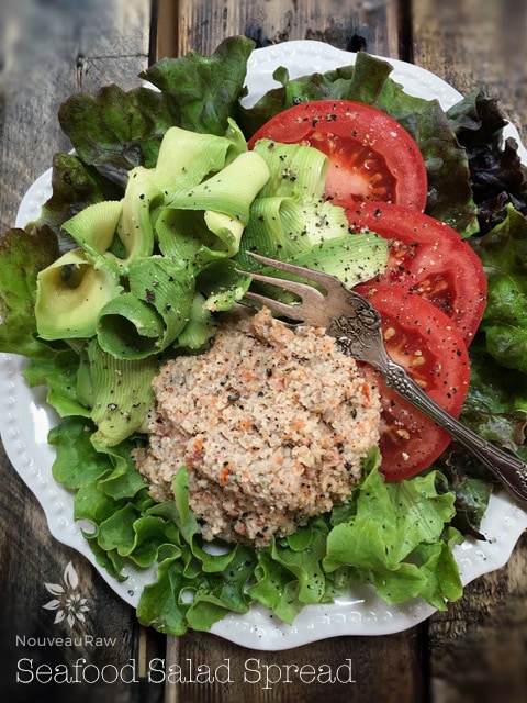 raw vegan Seafood Salad Spread served with fresh tomato and avocado