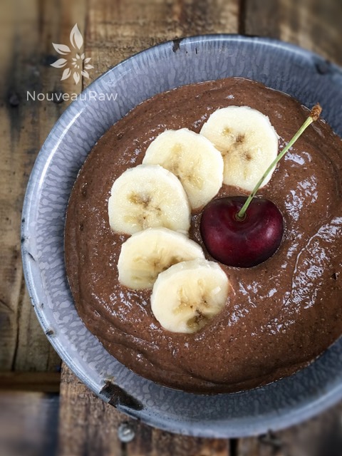 an over head shot of raw vegan Spicy Banana Chocolate Chia Pudding served with fresh fruit
