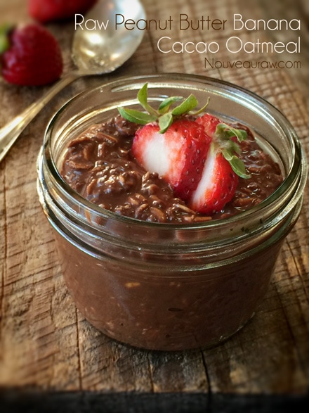 Nutritious Raw Peanut Butter Banana Cacao Oatmeal with sliced strawberries at top