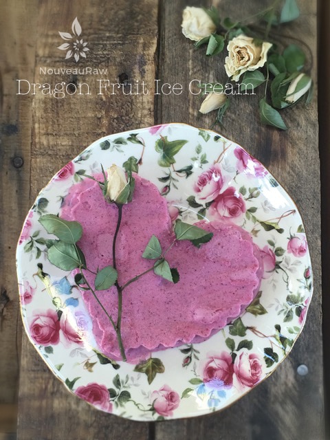 raw vegan Dragon Fruit Ice Cream shaped like a heart of a pink and white china plate