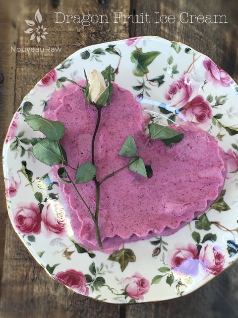 over view of raw vegan Dragon Fruit Ice Cream served on a plate with a dried rose
