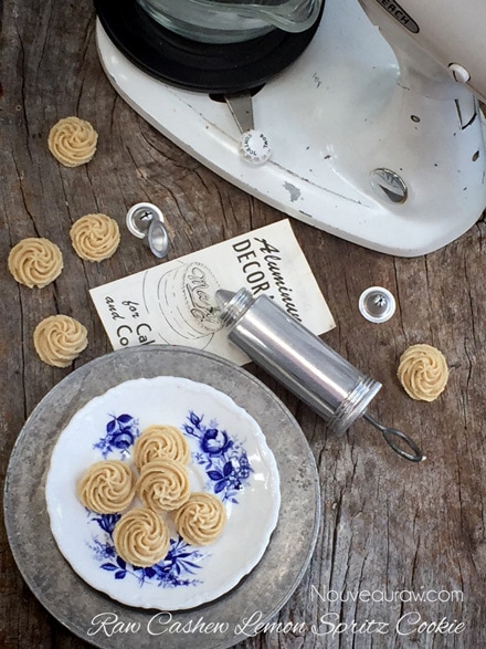 an over view of Cashew Lemon Spritz Cookies displayed with an antique mixer