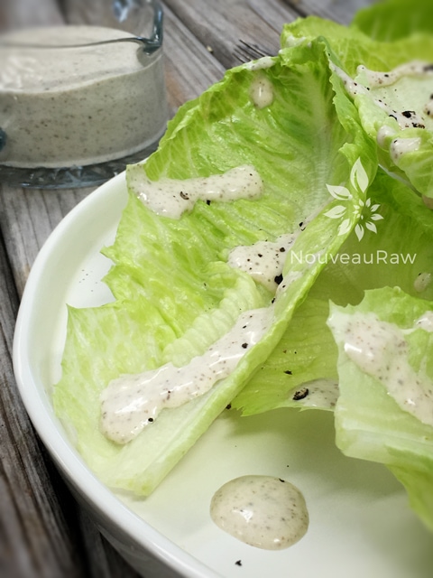 Ginger-Miso-Salad-Dressing drizzled over fresh crisp romaine leaves