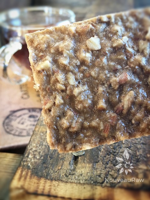 close up of raw Banana Bread Fruit Leather served with tea on a barn wood table