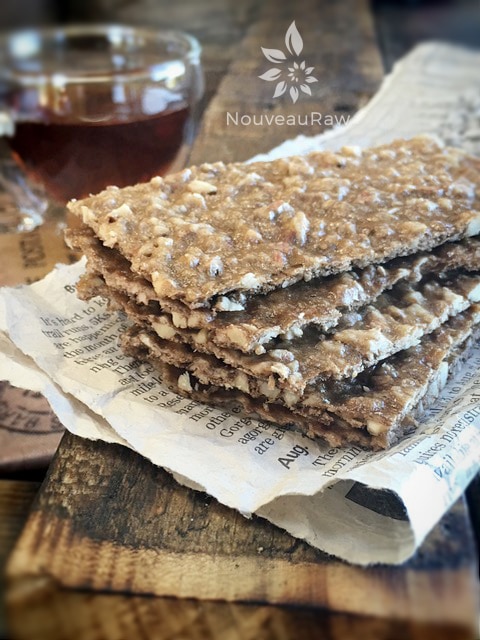 a stack of raw Banana Bread Fruit Leather served with tea on a barn wood table