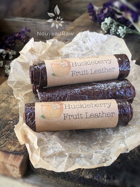 rolls of Honey Huckleberry Fruit Leather wrapped in plastic and labeled