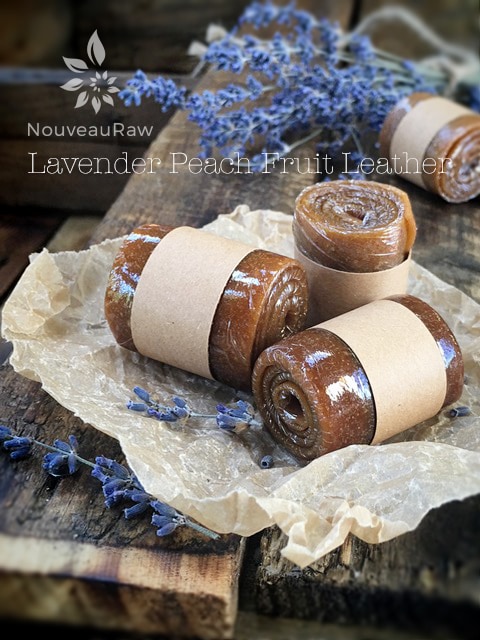 Lavender Peach Fruit Leather rolled up and presented with fresh lavender