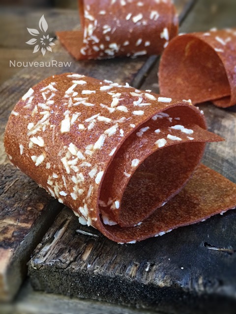 a close up of rolled up raw sugar free Paradise Sweet Almond Fruit Leather 