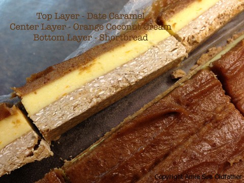 Top Layer Date Caramel, Center Layer Orange Coconut Cream & Bottom Layer Shortbread