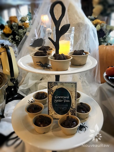 raw vegan gluten-free Chocolate Spider Pots displayed on a Halloween buffet table