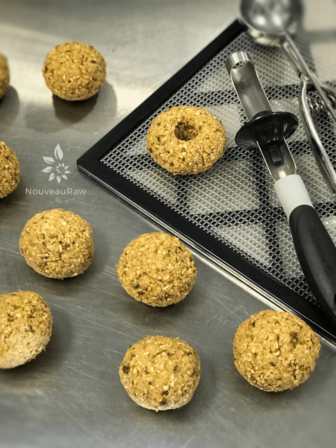 rolling dough balls to make Chocolate-Autumn-Harvest-Pumpkin-Donuts-3