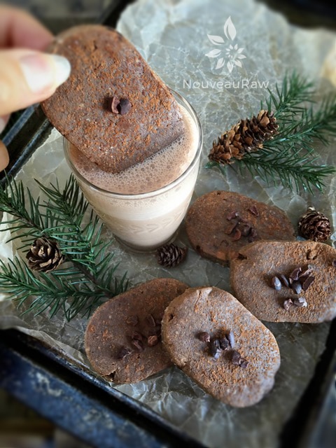 dipping Almond Chocolate & Coffee Biscuit Cookies in raw chocolate almond milk