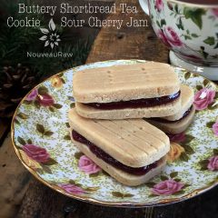 raw vegan Buttery Shortbread Tea Cookie with Sour Cherry Jam displayed on fine china