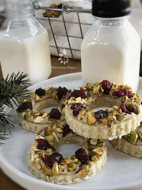 delicious raw vegan gluten free Lemon Pistachio Wreaths served with almond milk