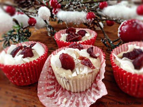 raw vegan Orange Cream & Cranberry Fudge in small cup cake wrappers for individual servings