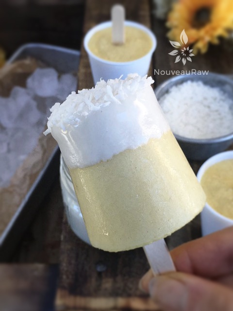 raw vegan Pineapple Mango Orange Ice Cream made in Dixie cups, dipped in icing and shredded coconut