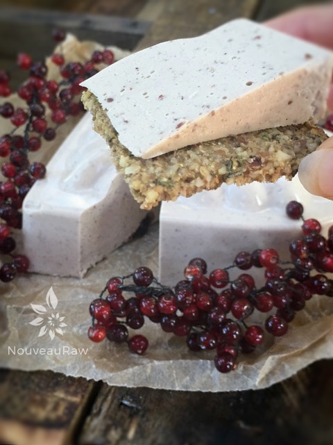 vegan Sweet Cranberry Cheese sliced and ready to eat on a cracker