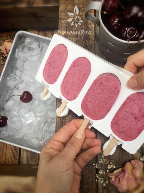 using my favorite molds to create a close up of raw vegan Cherry Coconut Banana Popsicles 