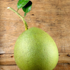 pomelo-on-wooden-table