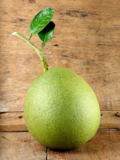 pomelo-on-wooden-table