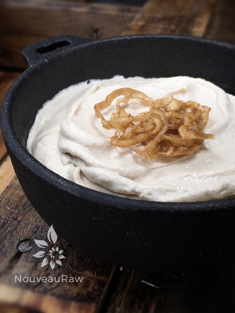 a close up of Caramelized-onion-spread in a cast iron dish