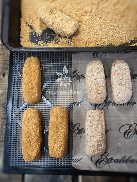 Shape the fishsticks and give them a dunk in the crumbs. Place on the dehydrator tray and dry.