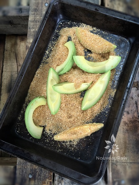 coating the avocado slices when making raw vegan Smoked Paprika Avocado "Fries" served with raw tartar sauce