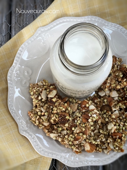 an over view of Apple and Fig Granola served on a white plate and with almond milk
