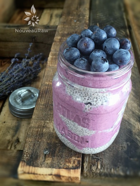 raw vegan Blackberry Chia "Jarfait" served in a mason jar with fresh blueberries on top