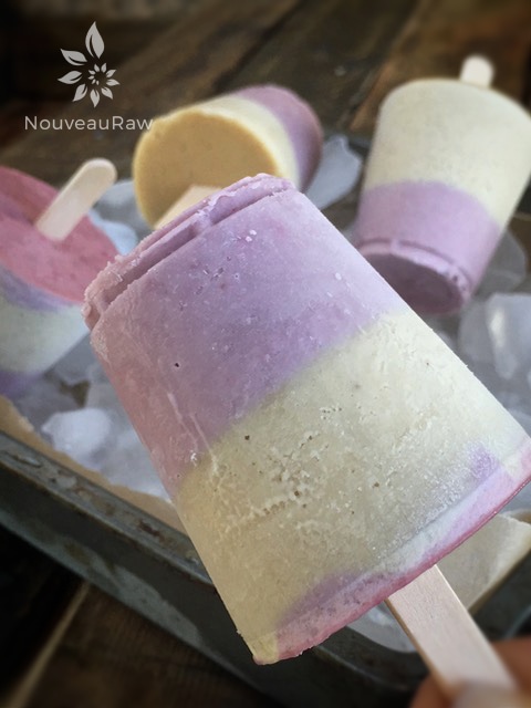 a close up of raw vegan Peanut Butter & Jam Dixie Pops served in a tin of ice