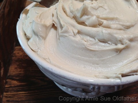 white creamy frosting of the raw vegan gluten-free Cherry Chip Layer Cake 