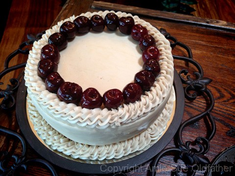 first ring of cherries added to the raw vegan gluten-free Cherry Chip Layer Cake 