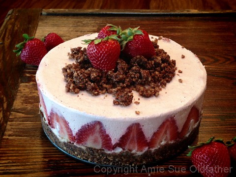 Creamy & Smooth Raw Strawberry Rhubarb Cream Cake topped with Strawberries