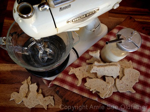 an over view of raw vegan gluten free Animal Crackers displayed with antique Hamilton Beach mixer