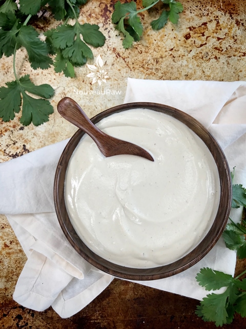 raw vegan Dairy-Free Sour Cream - cashew based in a wooden bowl